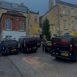 Darkened Image of Strou Electrical Vehicles Parked Up