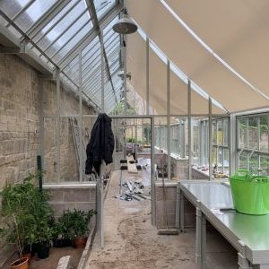 Detail of a copper-finish recessed light set into Cotswold stone