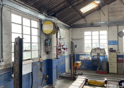 New UFO LED high bay lighting illuminating the Bath Road Garage workshop floor