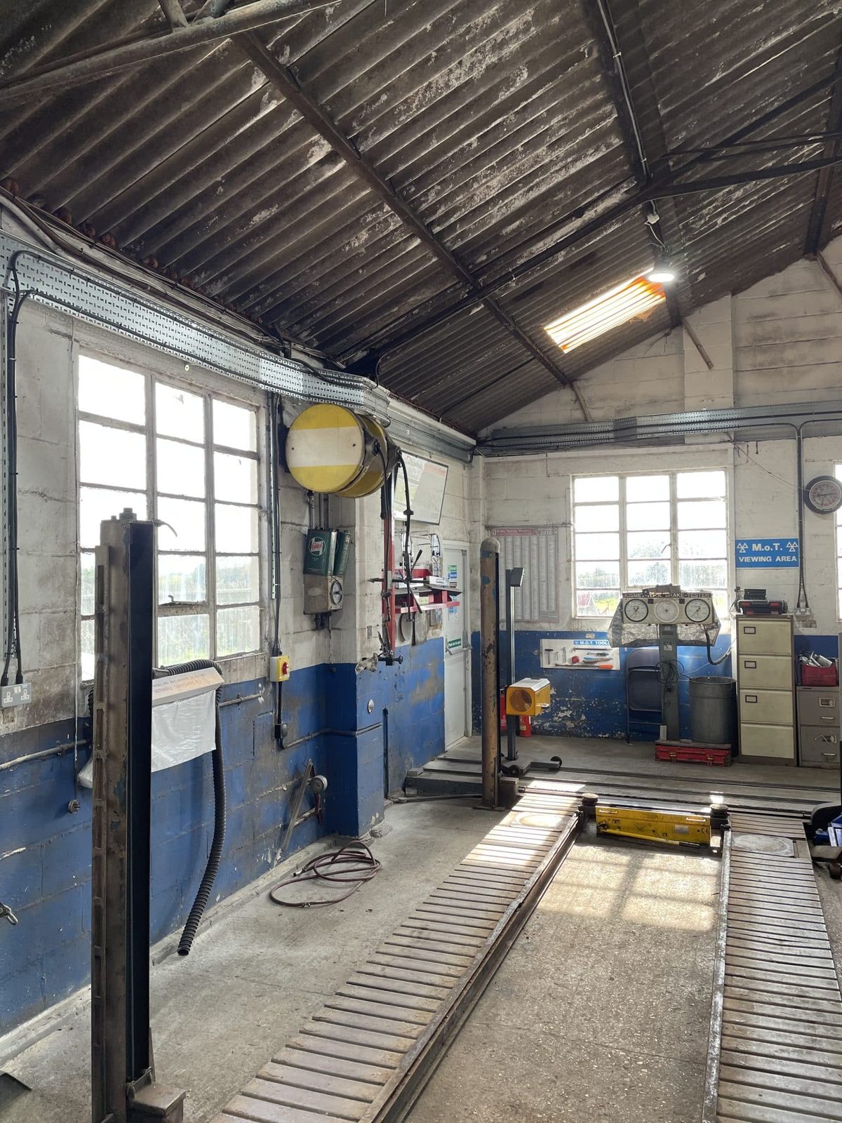 New UFO LED high bay lighting illuminating the Bath Road Garage workshop floor