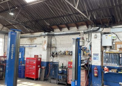 Vehicle ramp at Bath Road Garage on a dedicated supply installed during the full commercial rewire