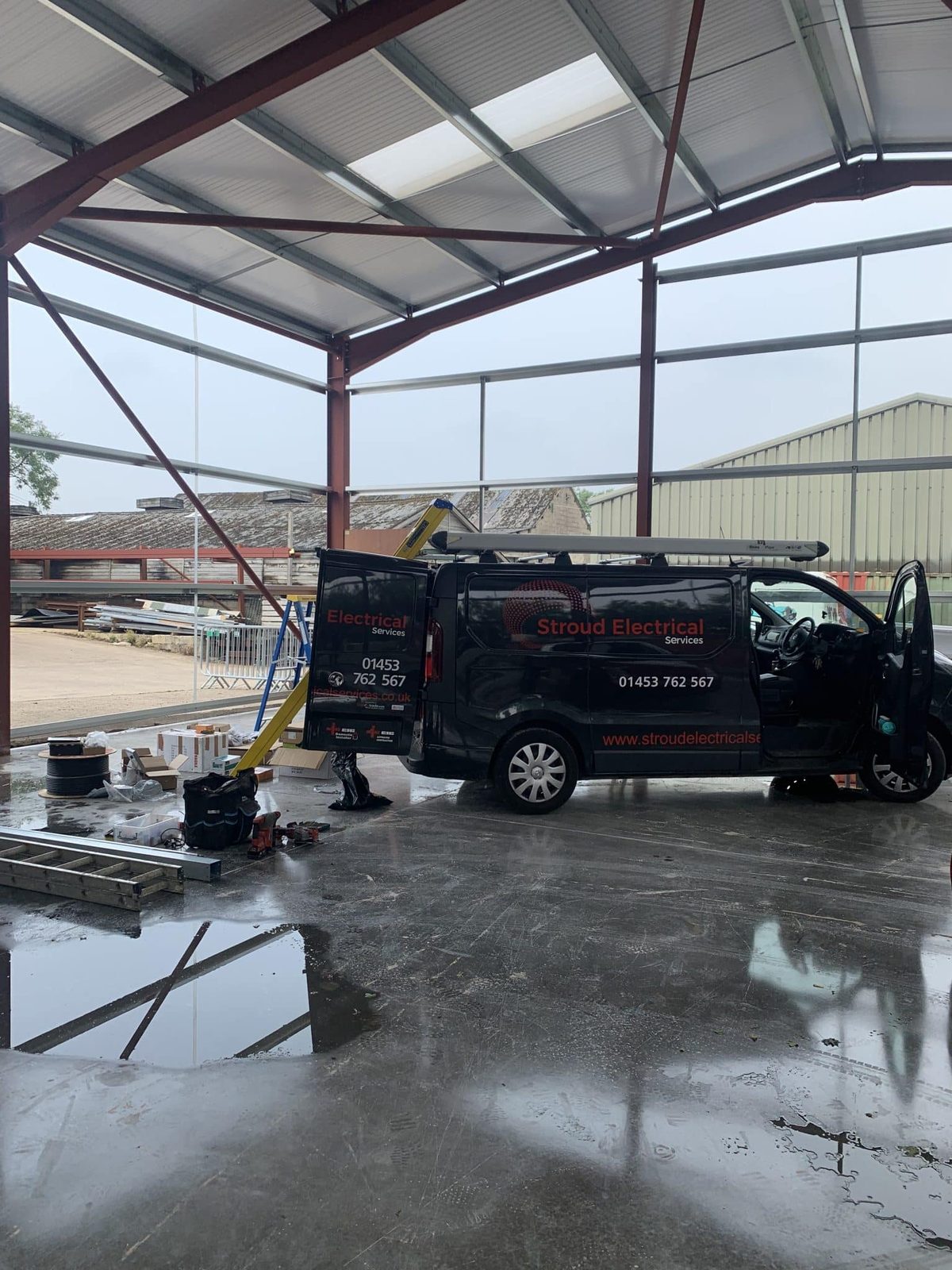 Industrial fluorescent and LED lighting in the Bisley Marquees workshop